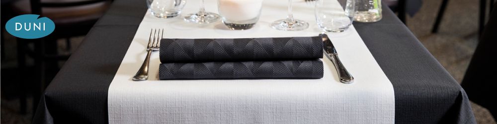Evolin Banquet Roll - Duni Evolin® is the ultimate textile-like product. Evolin® Banquet Roll combines the beauty of linen with the convenience of single-use and now features enhanced water-repellency. The main banner image shows Duni Evolin® Black table cover, White Evolin® tete-a-tete, and Duni Elegance® Crystal Black napkin. Order by 12pm for same-day despatch, Monday to Friday.